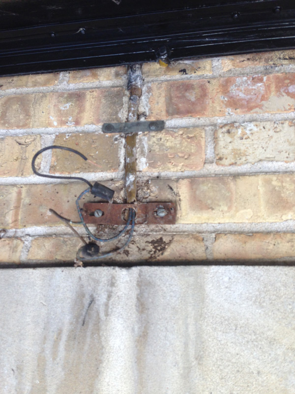 The pictured outlet is being feed from a junction box above with romex.  Romex is not approved for outdoor use.